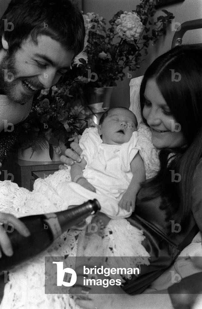 Sandie Shaw pop singer with her new baby daughter Grace at the Lewisham hospital where her husband Jeffrey Banks broke open a bottle of Champagne to christen the baby, January 1971