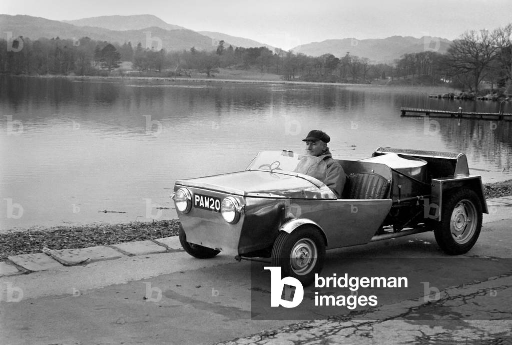 Man driving a steam powered out in the countryside
December 1970