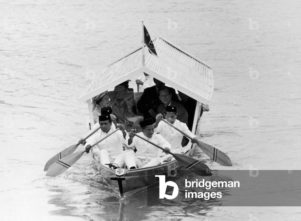 Royal visit to Malaysia. The Queen and The Duke of Edinburgh are transported by boat. March 1972 (b/w photo)