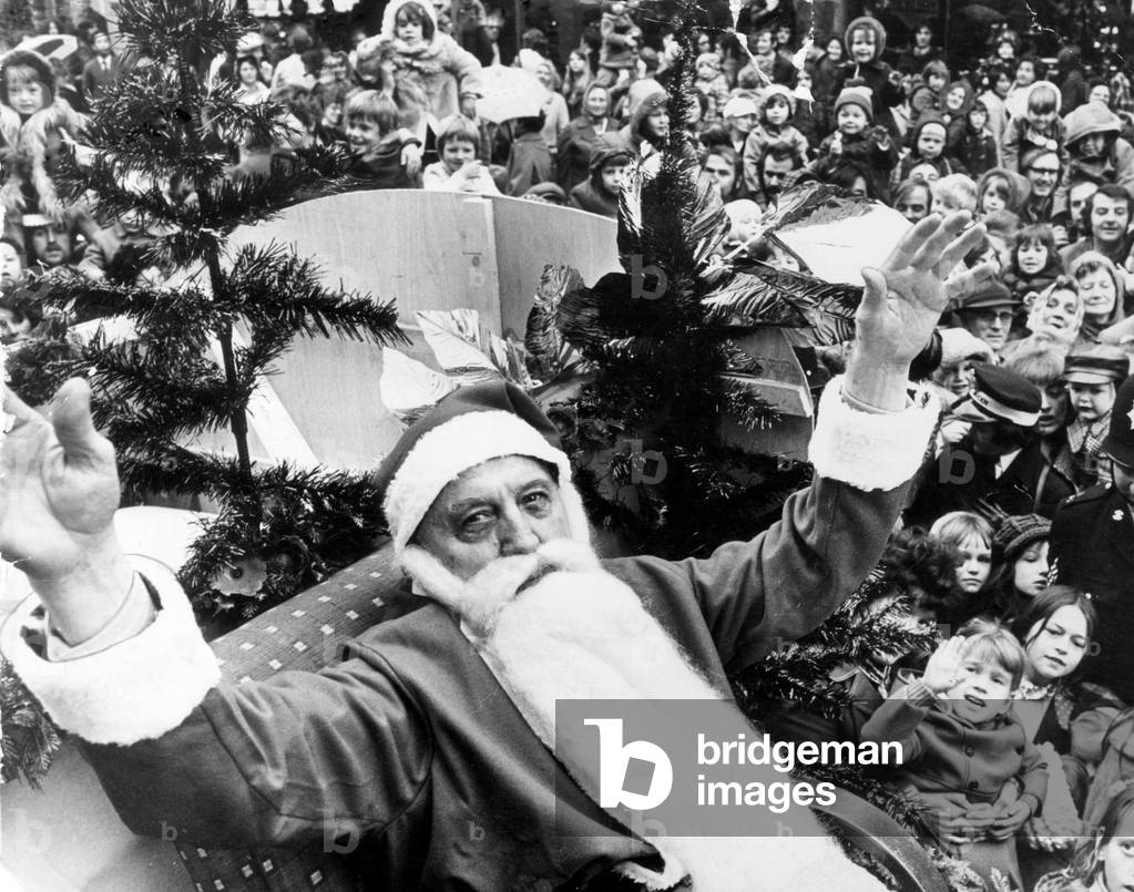 Father Christmas arrives in Swansea, welcomed by hundreds of city shoppers, 3rd November 1974 (b/w photo)
