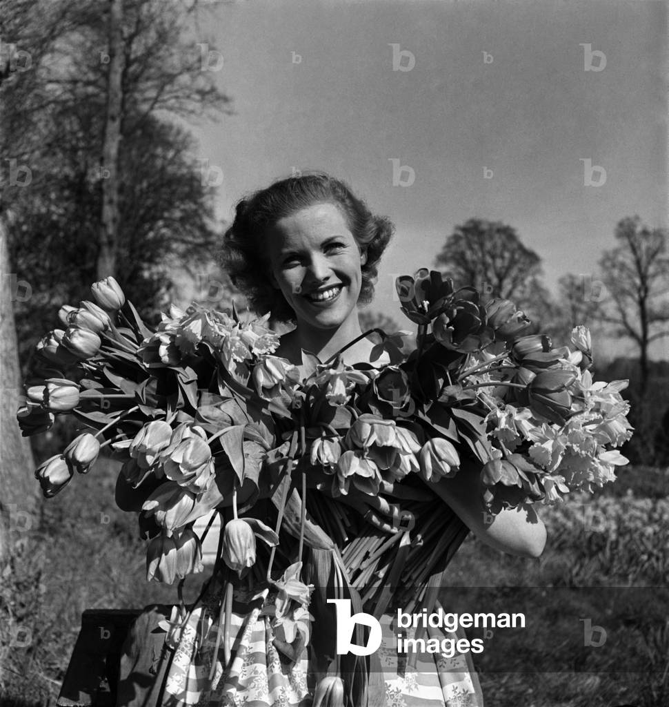 Actress Honor Blackman seen here with flowers in the gardens of Pinewood studio. March 1948 O12241-003