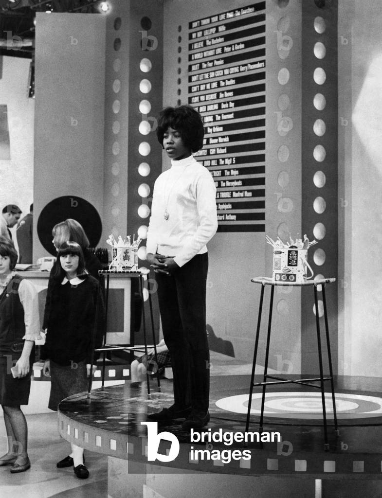 Rehearsing at the BBC TV studios in Manchester is Millie, who's pop hit My Boy Lollipop (which she is singing) is No.2 on the hit parade. She is keeping her fingers crossed that the song will go up to No.1. May 1964