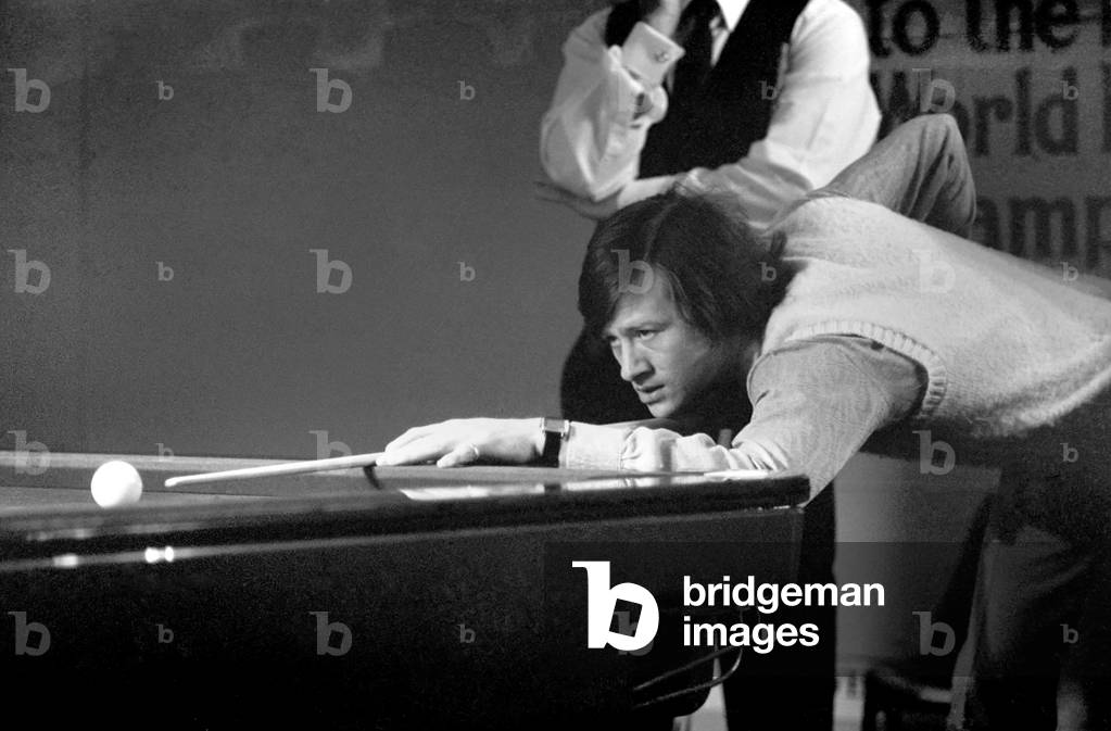 Snooker player Alex 'Hurricane' Higgins in action in the afternoon session of the Snooker championships, at Manchester City Hall, 22nd April 1973 (b/w photo)
