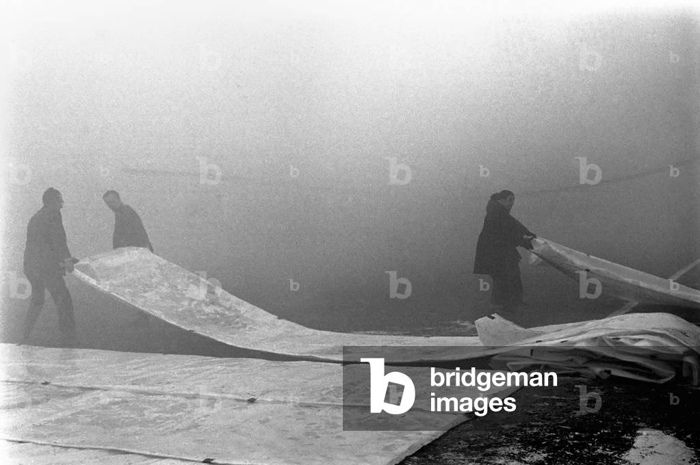 Cover onto the Manchester City pitch after the match had been declared off because of the foggy conditions. December 1969 (photo)
