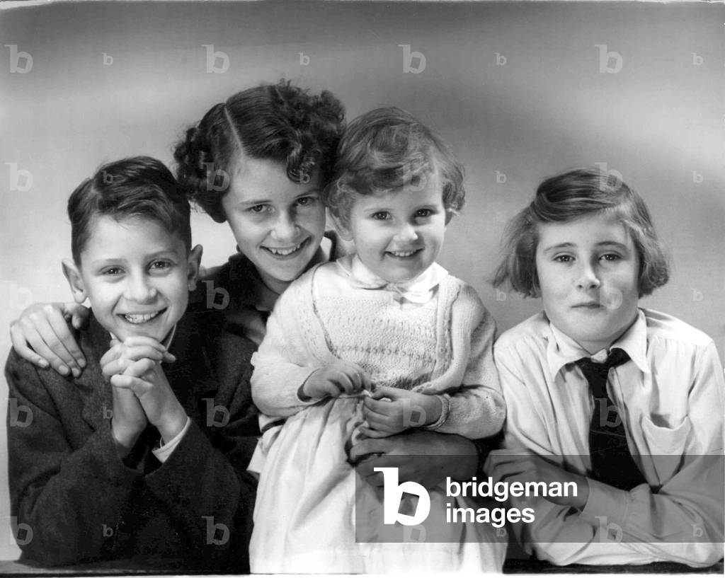 Family of children pose together for a group phototgraph, c.1945 (b/w photo)