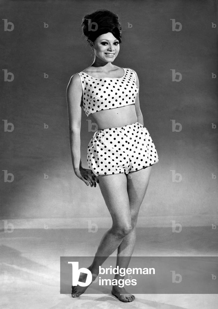 Reveille Fashions 1964, Carmen Dene modelling a two piece beach outfit, 10th June 1964 (b/w photo)
