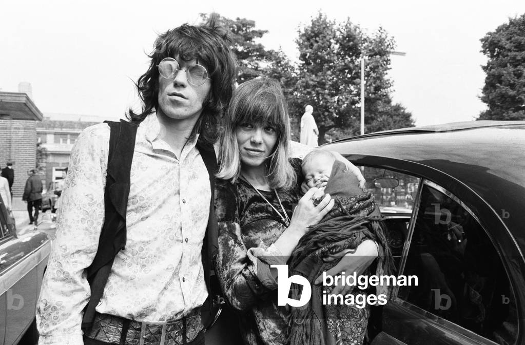 Keith Richard of the Rolling Stones at King's College Hospital on 18th August 1969 to collect his girlfriend Anita Pallenberg and their baby son Marlon who was born on Sunday 10th August, 18th August 1969 (b/w photo)