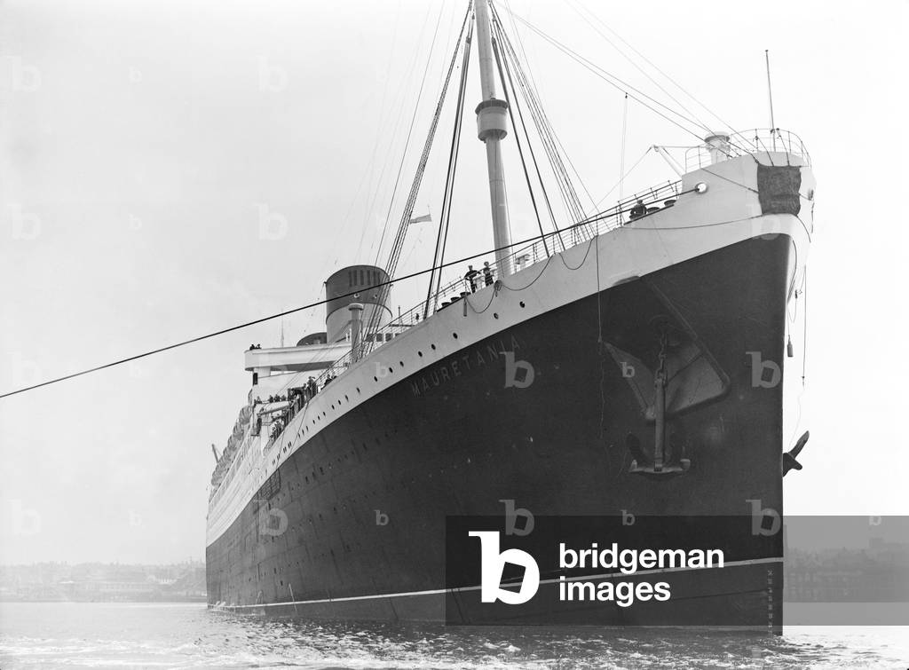 The RMS Mauretania brought up the Thames to King George V Dock at Woolwich. She is the biggest ship to ever come up the Thames to unload her cargo. 6th August 1939 (b/w photo)