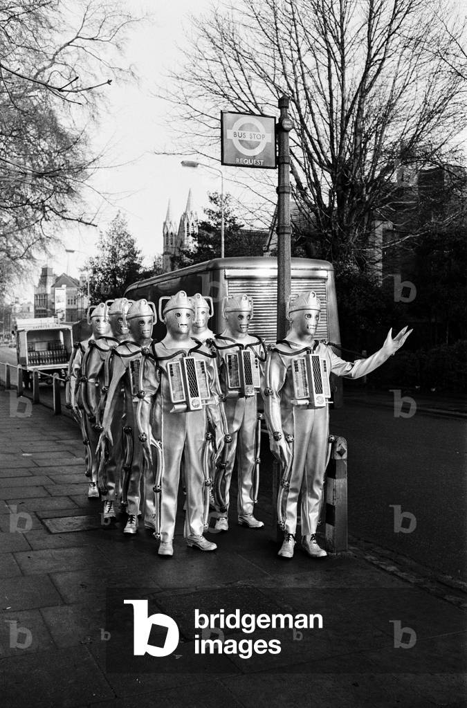 Doctor Who 1967 BBC TV Programme. The story features the return of the Cybermen in episodes titled The Moonbase, first broadcast 11th February to 4th March 1967. Pictured hailing a bus, outside Television Studios, Ealing, 19th January 1967 (b/w photo)