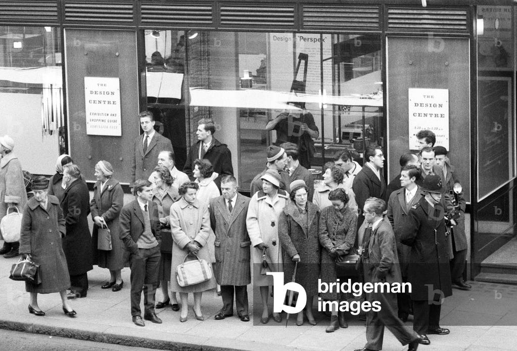 Public waiting to see Lord Snowdon, (Anthony Armstrong Jones), who begins work at the Design Centre, 28 Haymarket, near Piccadilly Circus, London. The Centre acted as the Design Council's headquarters, and it provided the Design Council with a permanent public space to present displays of contemporary British design, along with a changing programme of themed special exhibitions, 23rd January 1961 (b/w photo)