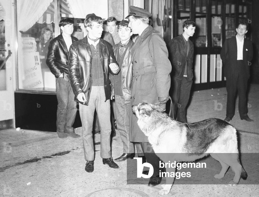 Police are called to the Criterion restaurant on Clacton sea front following a disturbance between to groups of youths . Over the 1964 Easter weekend several scuffles between Mods and Rockers broke out in the Essex seaside town. 30th March 1964 (b/w photo)