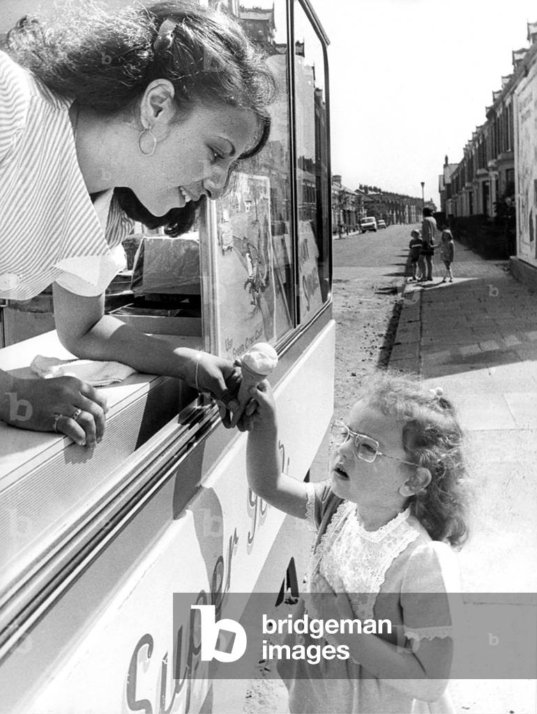 Anna Kane in her ice cream van helps little Mandy Harkness to learn the Green Cross Code. All part of teaching Heaton children road safety in June 1975 (b/w photo)