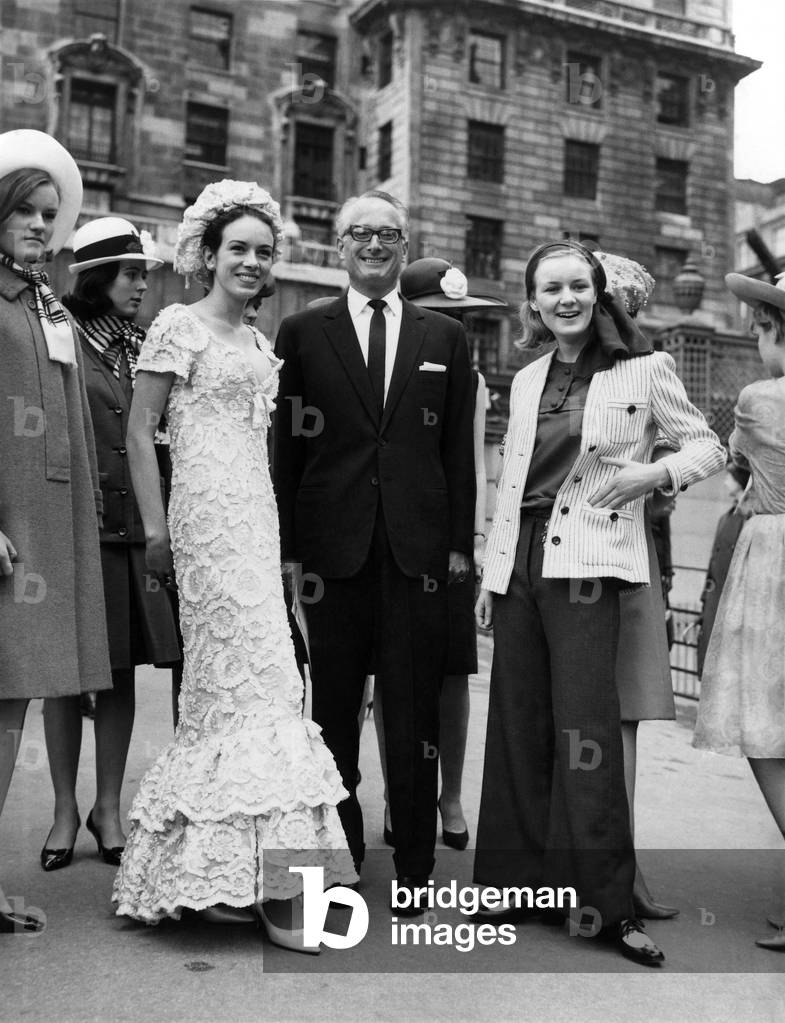 The Duke and the debs went to a fashion show yesterday (Monday 13-4-64). The Duke of Bedford to compare it. The debs, 17-year-old-Jessica Kitson (left), to model that long white lace evening gown, 