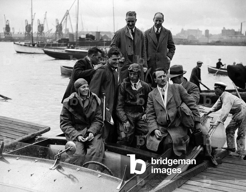 Amelia Earhart, Aviation Pioneer Atlantic Flight. 1st female to fly the Atlantic. Amelia Earhart and her pilot Wilmer Stultz coming ashore Burry Port in South Wales from their Fokker aircraft 'The Friendship', 
18/06/1928