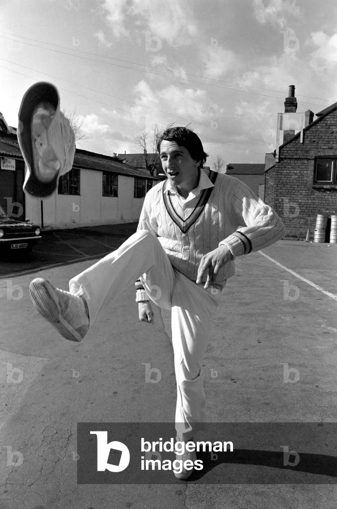 Cricketer Derek Randall and his repertoire of tricks photographed at Trent Bridge as he prepares for the new season. The hat flicked up from the foot to the head, April 1977 (b/w photo)