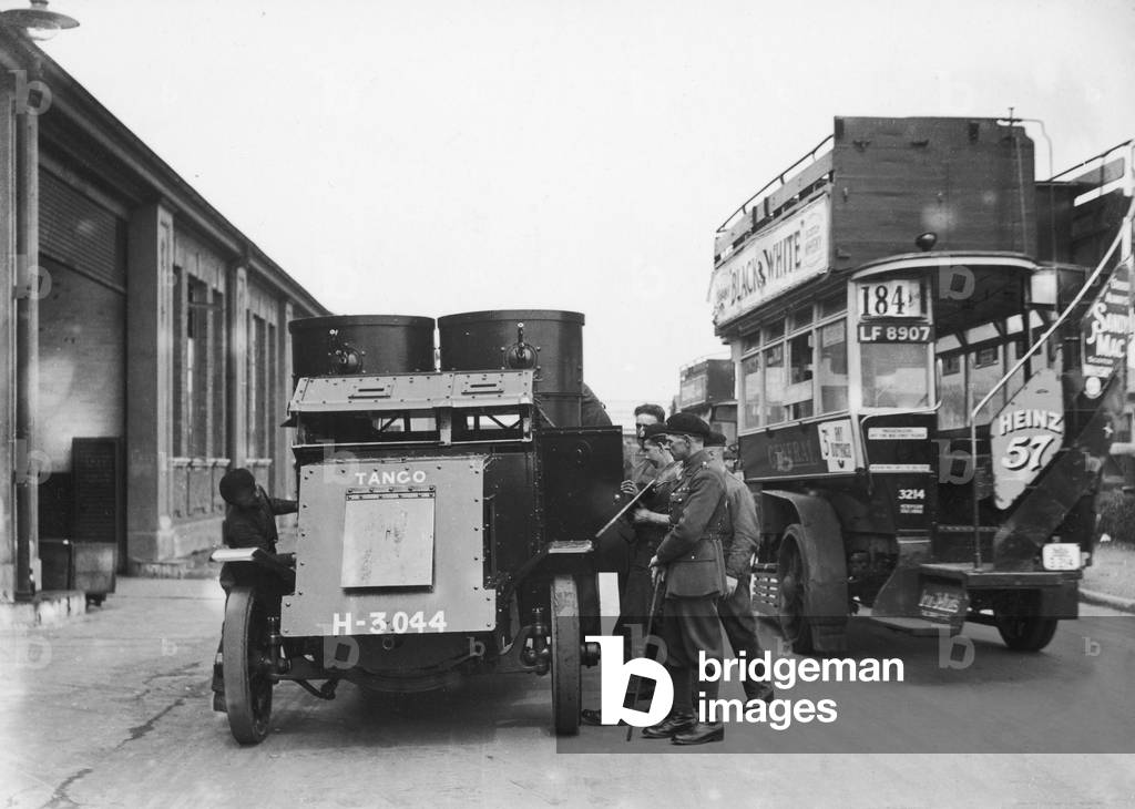 Soldiers seen here with their Austin armoured car at a bus depot, on the 10th day of the General Strike. The national dispute came about after negotiations between the miners and mine owners failed over wages and the strike began on 3 May 1926. Millions obeyed the strike call, bringing transport systems to a halt while newspapers were not printed. The government responding by using volunteers to run trains and buses and sent in troops to move supplies from the London docks. There were clashes between police and crowds in many areas and at least 4000 strikers were arrested. There were attacks on buses and trains, including the derailing of the Flying Scotsman. The strike was called off unilaterally by the TUC on 12 May with no guarantees of fair treatment for the miners who fought on to bitter defeat in October. 12th May 1926 (b/w photo)