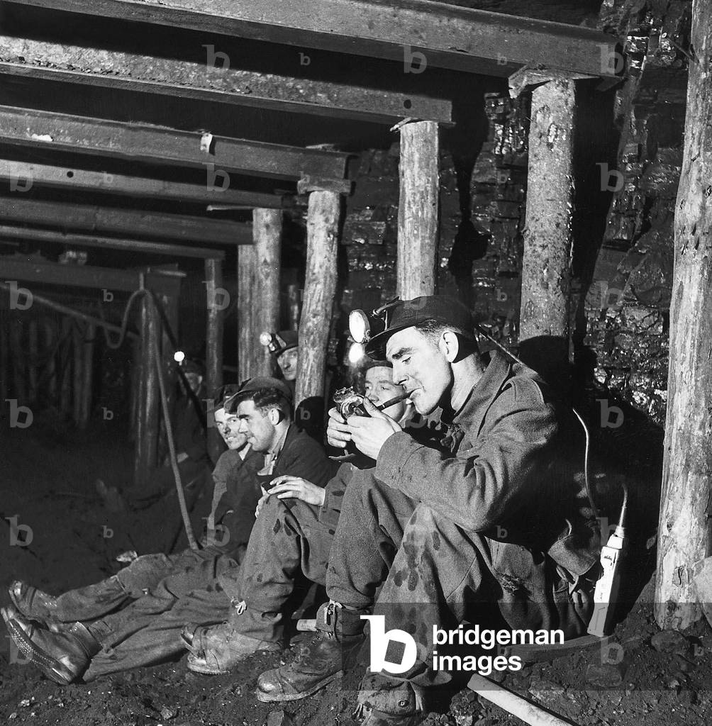 Coal Miners stopping for a cigarette break at the Whitehill Colliery, 1947 (b/w photo)