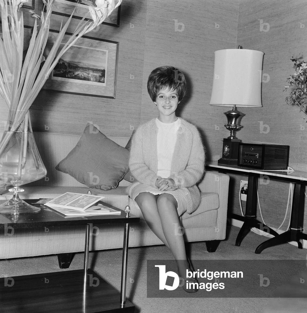 American pop singer Brenda Lee in her room at the Hilton Hotel in London. 20th August 1964 (b/w photo)