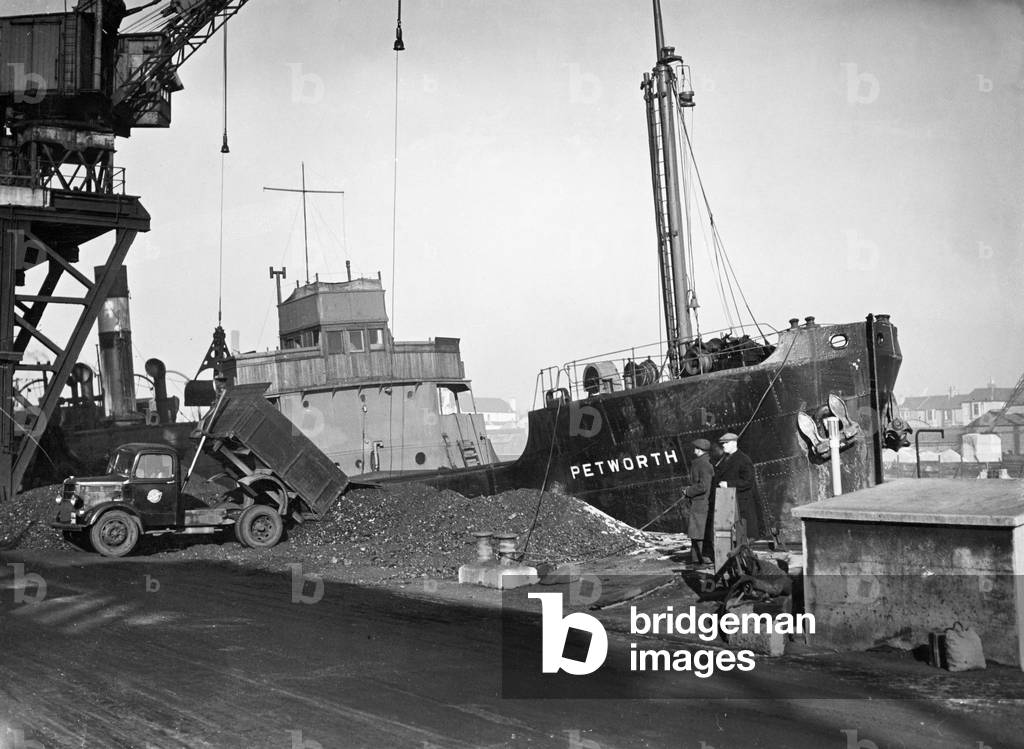 The Collier SS 'Petworth' unloading her cargo of coal at Soreham gasworks, Sussex, after arriving from Sunderland.
25th February 1947