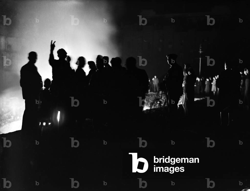 VE Day celebrations in London at the end of the Second World War. Crowds gathered in London appear in silhouette during the celebrations., 8th May 1945 (b/w photo)