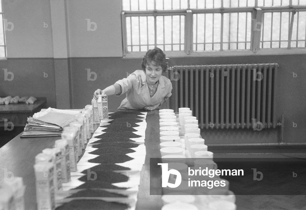 The tea taster at work. A sip, a quick taste and Mr Edward Pedvin, of Hollywood, near Birmingham has sampled one more of the 200 -250 sampoles on which he must pass each day at the Ty-photo Tea factory, Bordesley Street, Digbeth, Birmingham. 4th February 1960 (b/w photo)