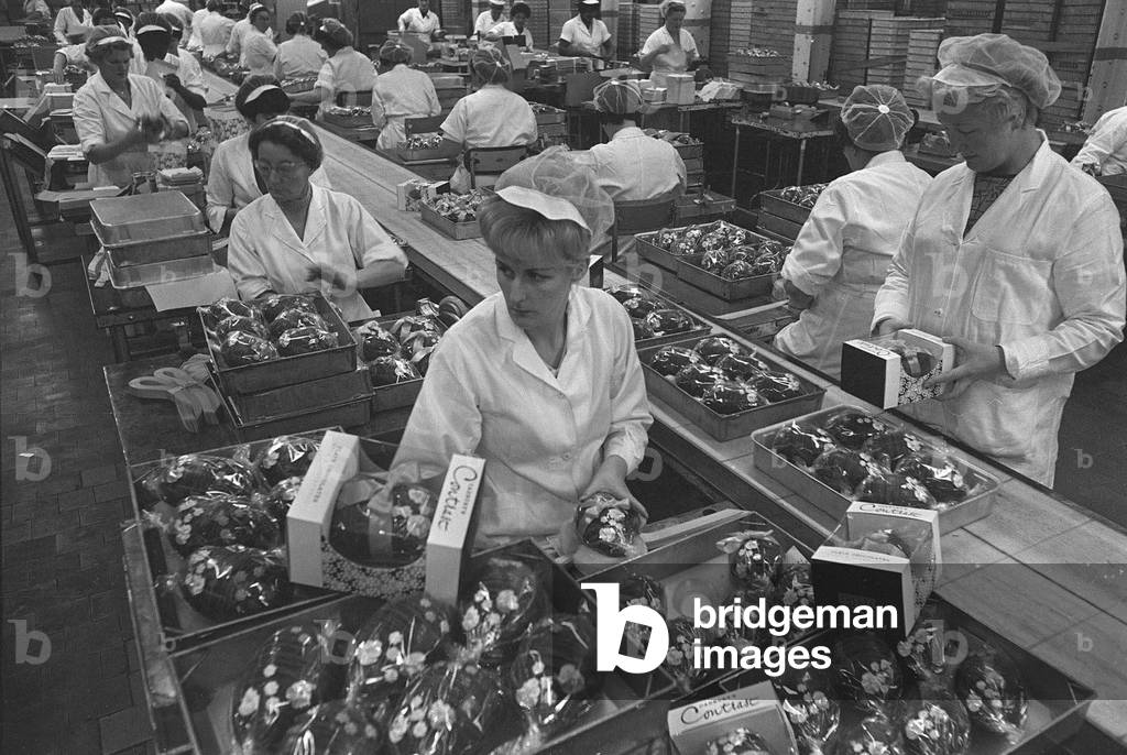 Cadburys Contrast Easter Eggs December 1966 Ladies working on the Factory Production Line wearing protective overalls, preparing eggs for the Easter celebrations, July 1964 (b/w photo)