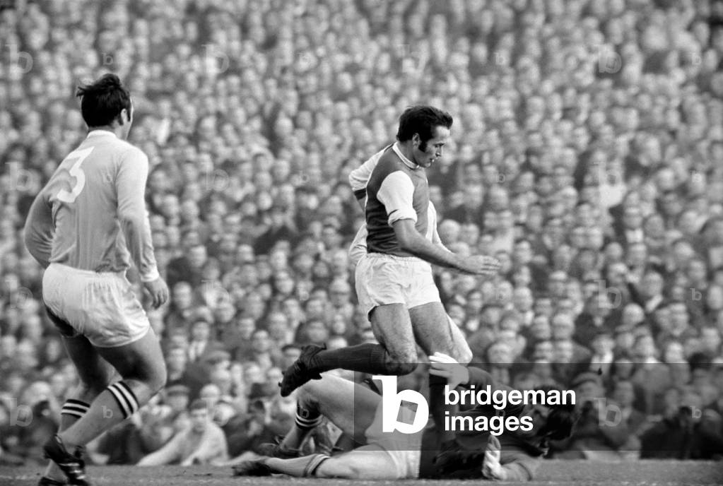 Sport Football. Arsenal vs. Manchester City. Peter Simpson Volleys back to his Goalie with Francis Lee (Forward). November 1969 (photo)