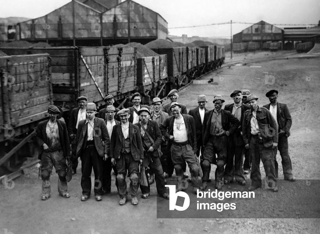 A train-Load in a day! Each of these sixteen miners, seen above, with the pit Deputy, shifted more than 200 times his weight in coal in one day - they smashed the output record for their seam, and probably created a record for the country, producing 288 tons. In one month the sixteen 