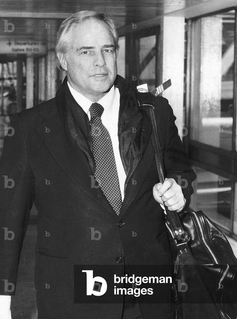 Marlon Brando Actor Arriving At Heathrow Airport From Canada, 24th March 1977 (b/w photo)