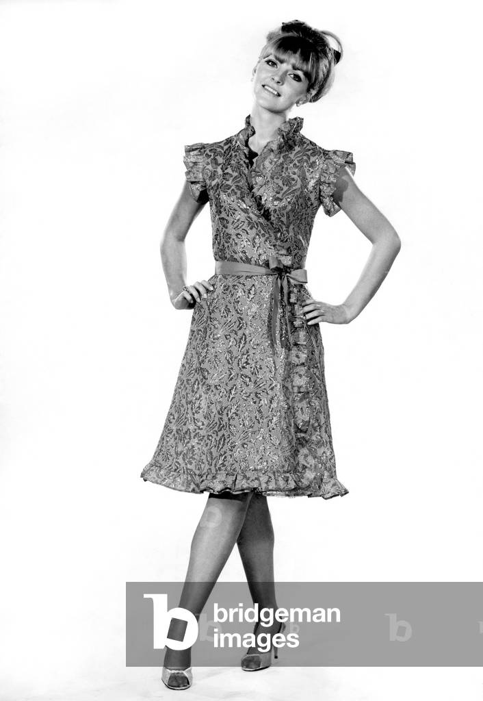 Reveille Fashions, Ann Roberts modelling a leaf pattern dress with matching belt, 10th September 1964 (b/w photo)