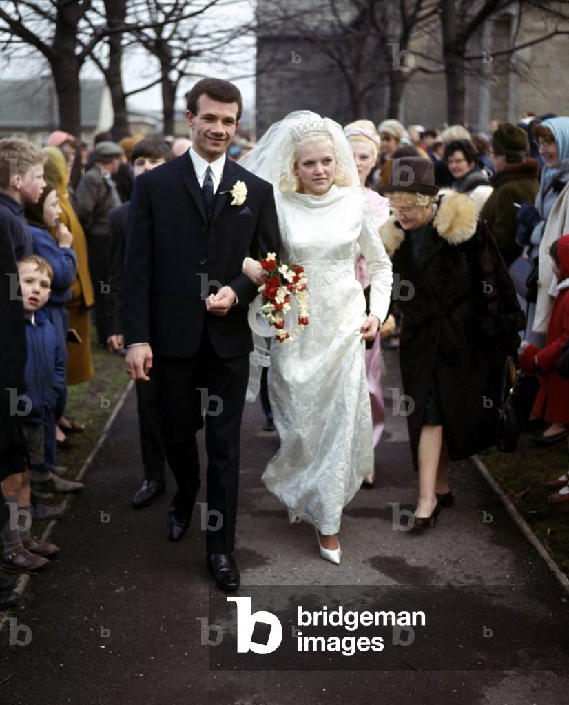 Leeds United footballer Paul Reaney with bride Sandra Proctor after their wedding ceremonyFebruary 1967 (photo)