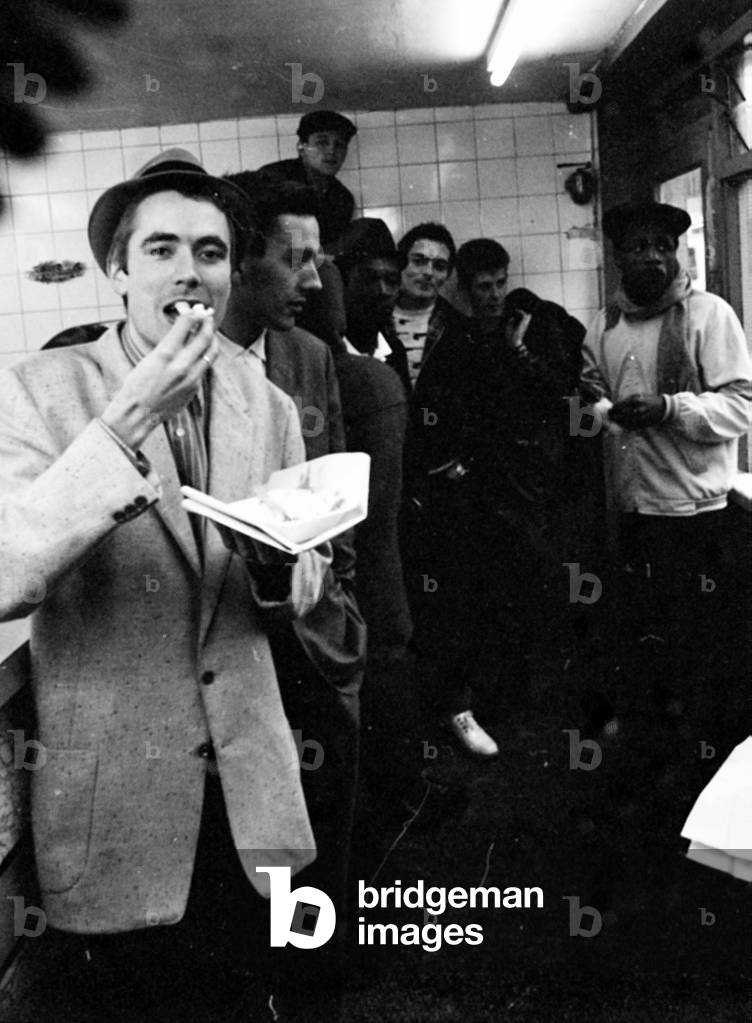 The Specials pop group in chip shop called 'The Parson's Nose' in Bishop Street, Coventry.