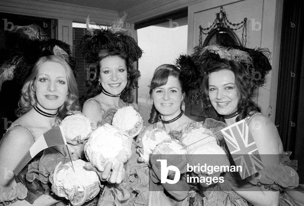 Can-Can Dancers: Table Decorations: Due to the Mild winter we are enjoying new Cauliflower from Brittany is reaching this country 5 weeks early. Four Can-Can dancers Biba Brookman, Diana Regal, Robbie Hart and Nicky Billiyard introduced the delicious vegetable is a spirited Can Can which they call the Cauli Can Can. January 1975