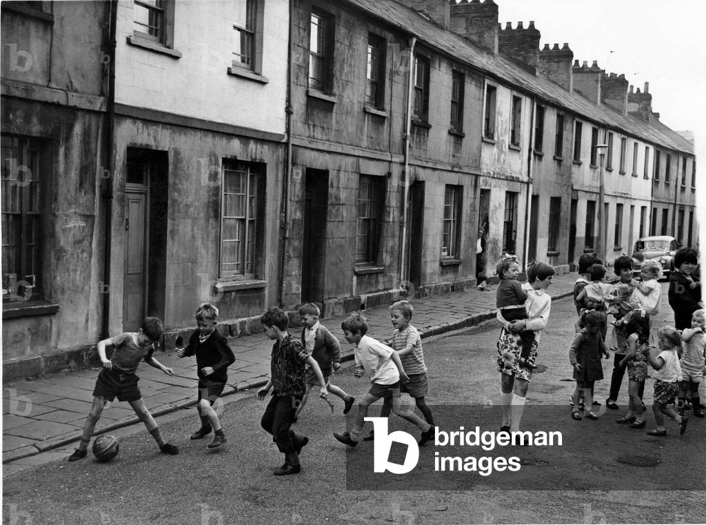 Children playing football in the street at Sandon Place, in Adamsdown, CardiffAugust 1966 (photo)