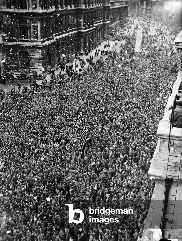 VE Day celebrations in London at the end of the Second World War. Some of the huge crowd gathered in Whitehall for the celebrations., 8th May 1945 (b/w photo)