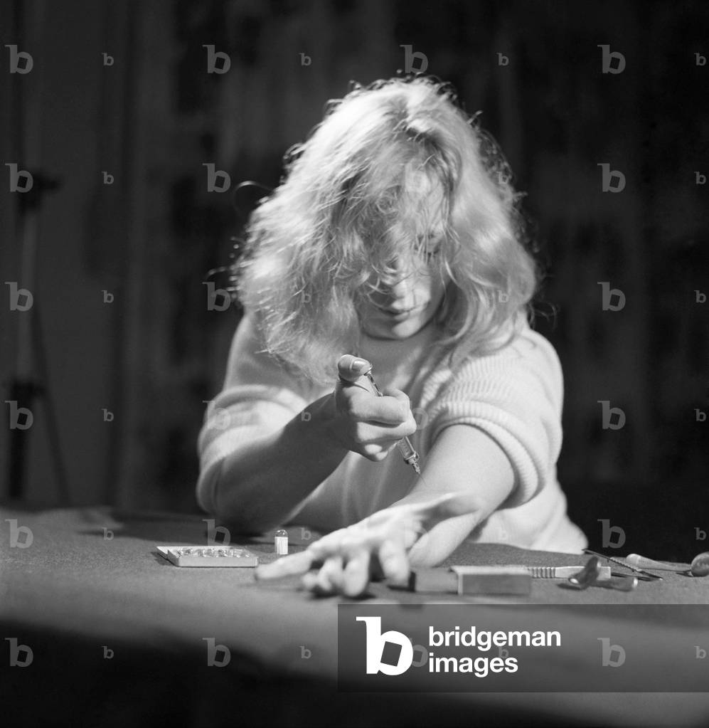 Model shot: Drug addict seen here taking drugs. 1960