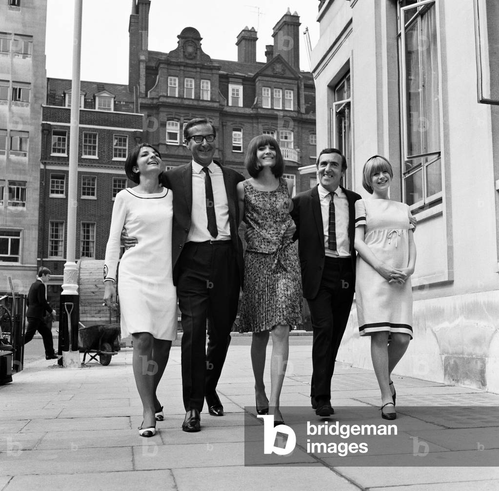 Southern Independent Television held a reception at the Nightingale restaurant in Berkeley Square this morning at which they showed a preview of their new series 'Ladybirds' in which 7 singers tell all about their lives to interviewers Shaw Taylor and Terence Carroll. As 'luck' would have it the long arm of the law descended on photographers trying to take pictures of three of the Ladybirds - Marianne Faithfull, Sandie Shaw and Dana Valery - on the pavement in the square, with a request to 'move along there'. Pictured is Terrence Carroll and Shaw Taylor with the three singers. 13th August 1965 (b/w photo)