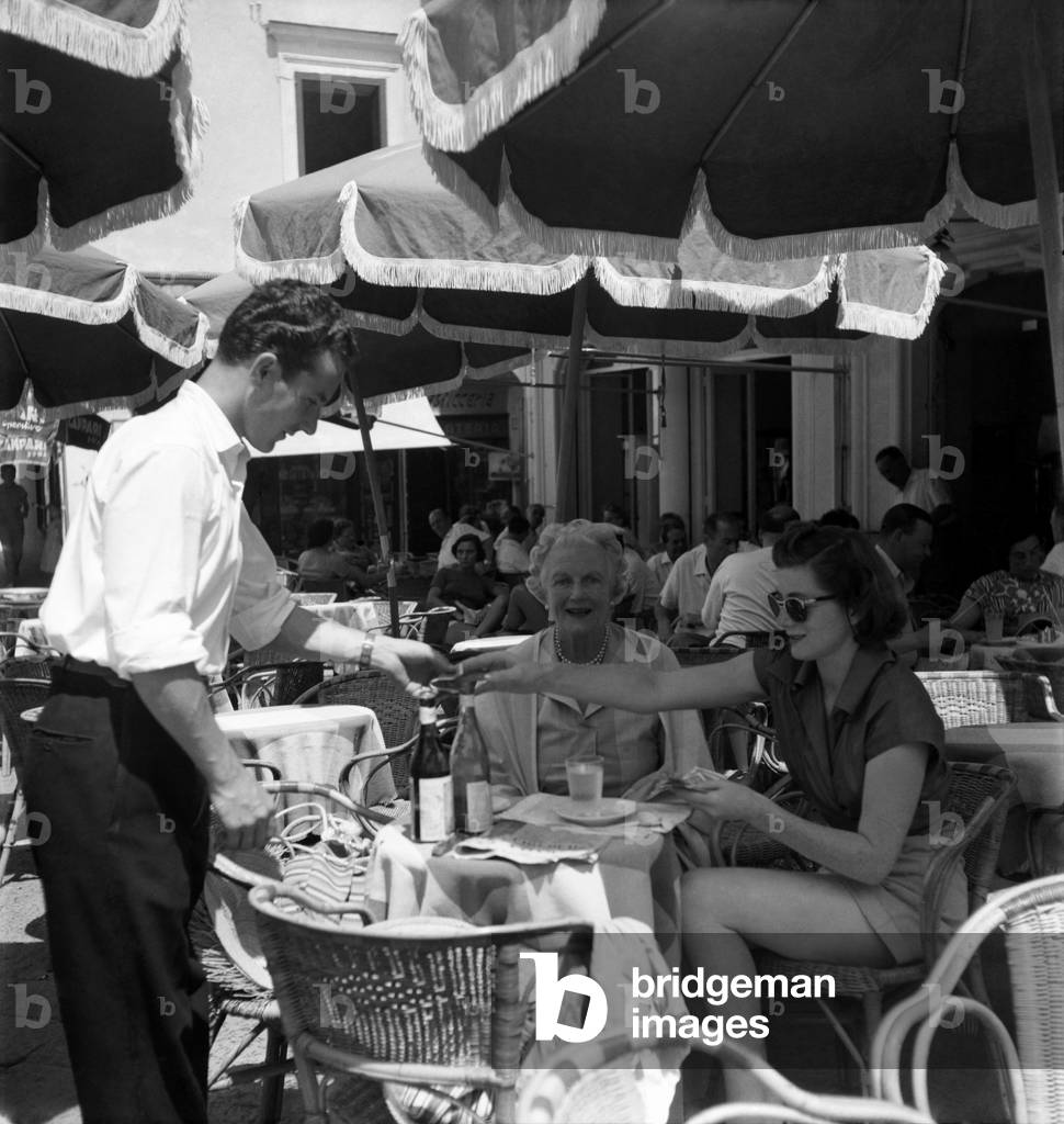 Photographed in Piazza Umbarti, Capri on holiday are Mrs. Clementine Churchill and her actress daughter Sarah Churchill. August 1952 (b/w photo)