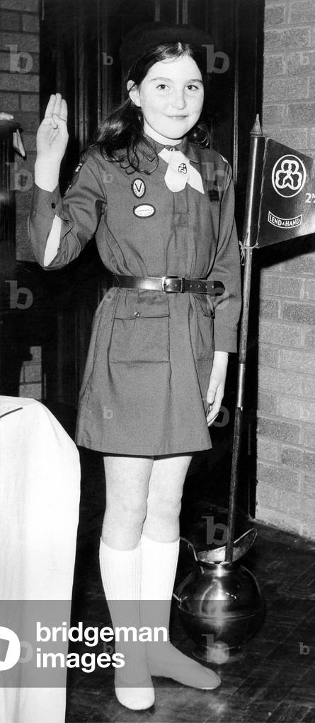 Nine year old Marion Scott in a 1974 Brownie Uniform. The current tunic costs about £1.50, the tie 18p and the beret 35p, 1974