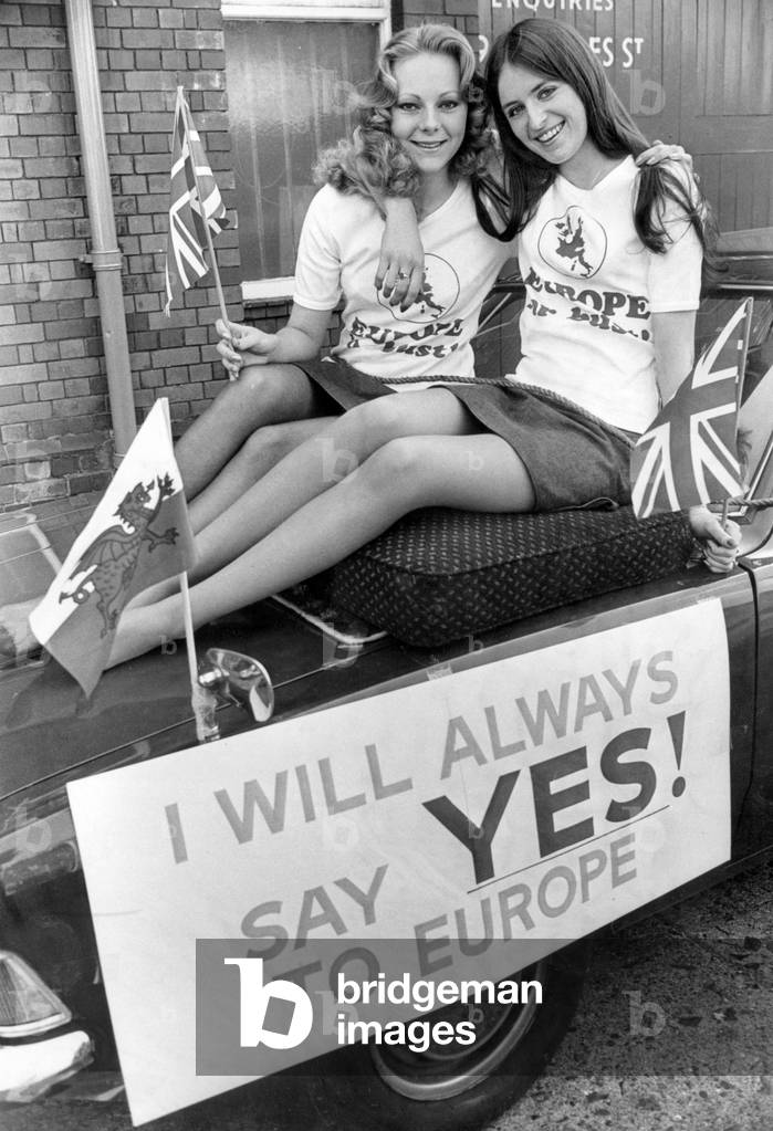 UK European Communities Membership Referendum, 1975, also known as the Common Market referendum, was held on 5th June 1975, to gauge support for the country's continued membership of the European Economic Community. Our Picture Shows, Pro Europe Campaigners, Colleen Terrans 18 and Dawn Miller 21, riding on the bonnet of the leading car of the South Glamorgan campaign to Keep Britain in Europe drive through Cardiff this morning, Saturday 31st May 1975 (b/w photo)
