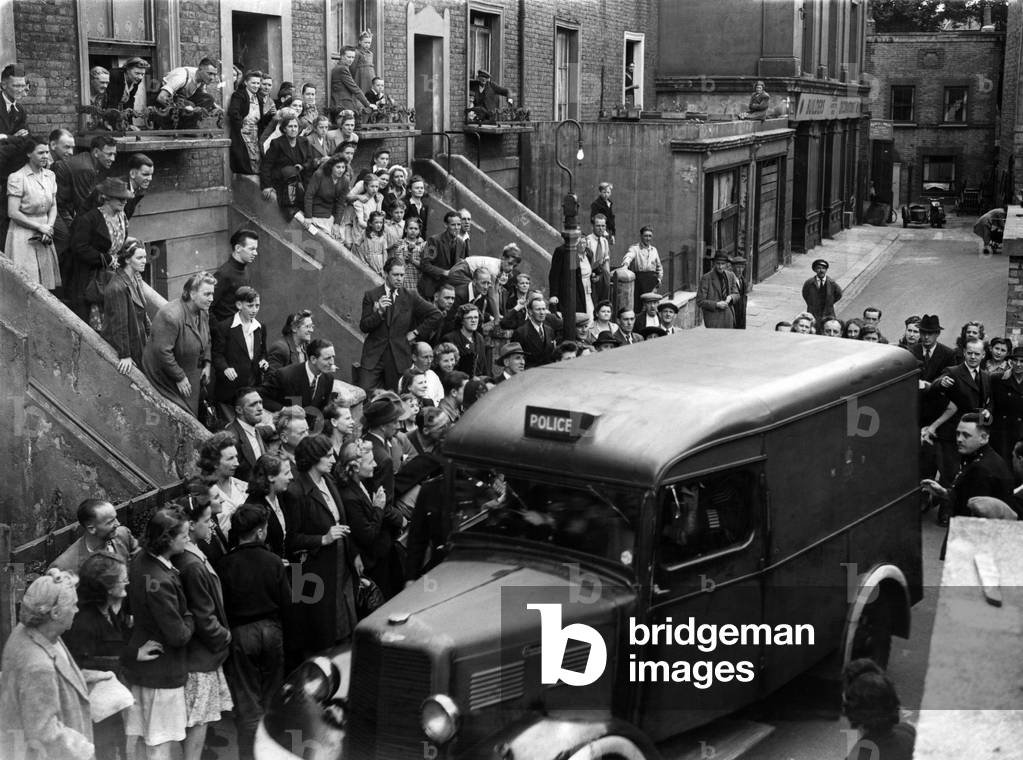 Crowds waiting to see Neville Heath leave from the back of the court in a police van. 6th August 1946.