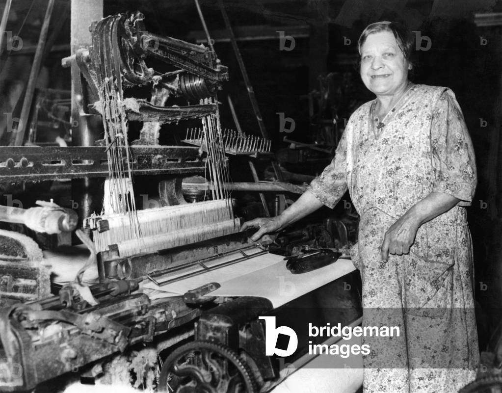 Mrs. Clara Abbott (70), at work on her loom in the cotton mills, April 1959