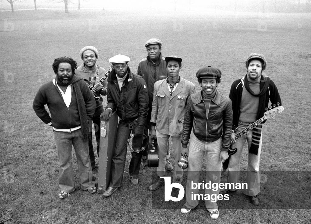 l-r Steve Nisbett, Basil Gabbidon, Michael Reilly, Selwyn Brown, Dave Hinds, Phonso Martin and Ronnie McQueen of Reggae group Steel Pulse, pictured in Handsworth, Birmingham, where they are all from, 22nd February 1978 (b/w photo)