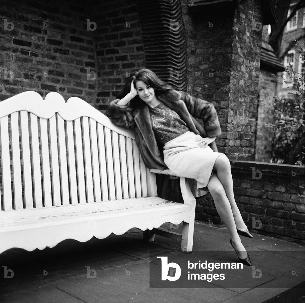 Parisienne actress Claudine Auger who will play Domino in the James Bond film Thunderball, seen here during an interview with the Daily Mirror show business reporter Donald Zec. 17th February 1965 (b/w photo)