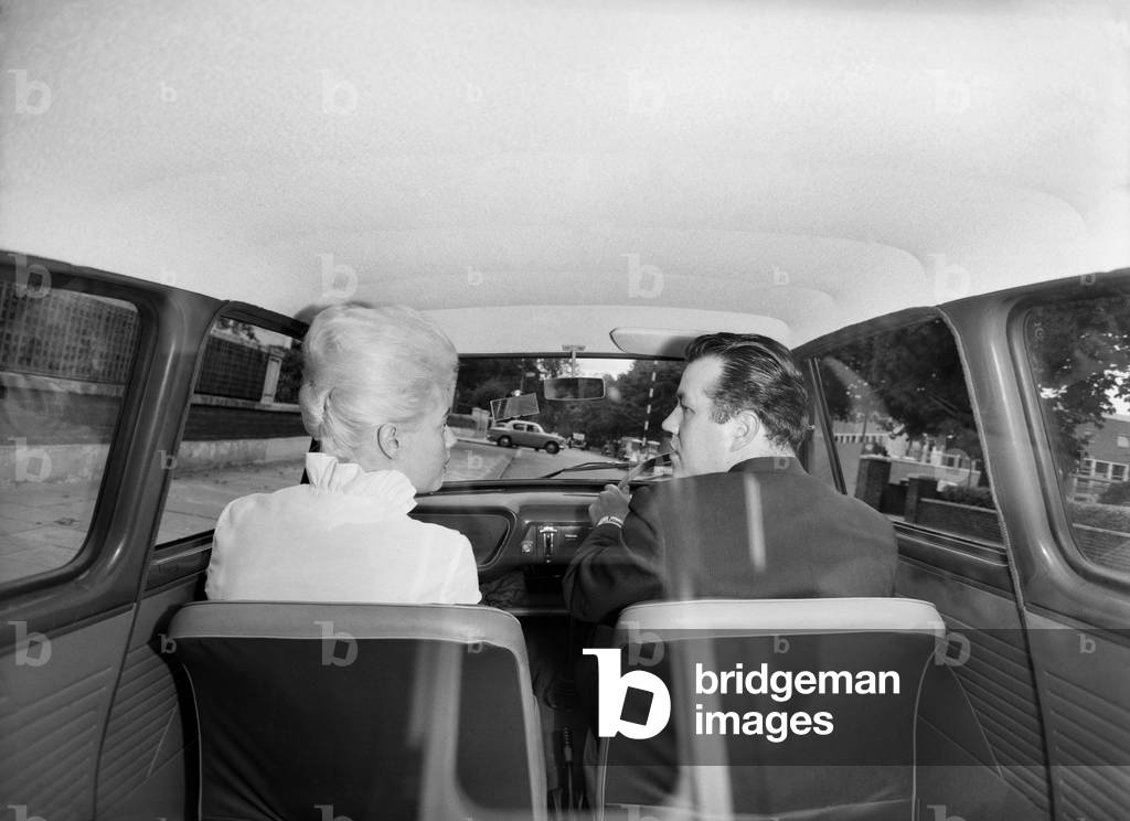 Tina Butler, woman driving instructor seen here giving a driving lesson, September 1962 (b/w photo)