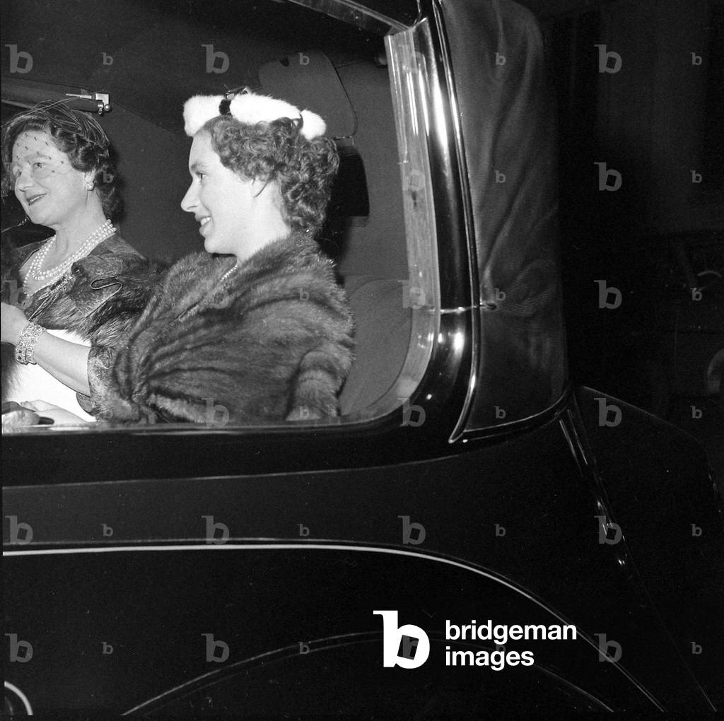 The Queen Mother and Princess Margaret seen here leaving the Salon of clothes designer Hardy Amies following a fashion show
December 1954