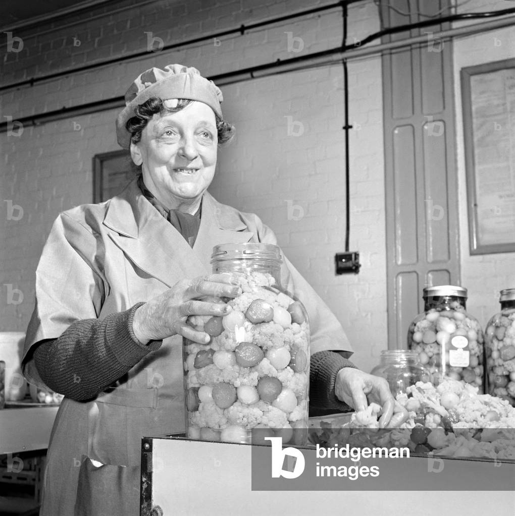 Pickle Packers: Pickle packers placing onions in jars, 1954 (b/w photo)