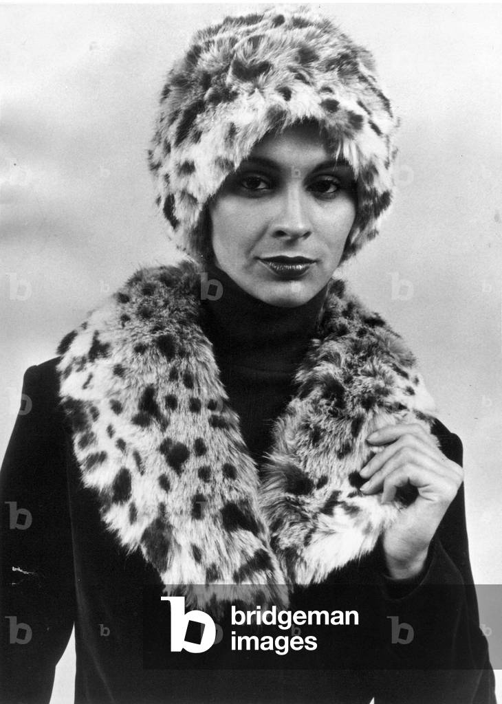 A model posing in the latest fake fur hat and scarf