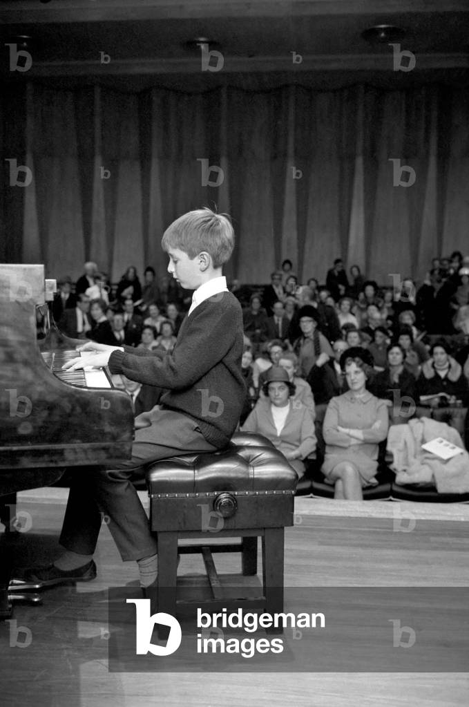 The biggest national event in the world of young pianists for two years, the Final of the National Junior Piano Playing Competition 1969, sponsored by the British piano makers, was held at the Purcell Room of the Royal Festival Hall this morning. The winner in the Junior section, 9 year old Francis Rayner from Glamorgan pictured playing an encore after being awarded the first prize. December 1969
