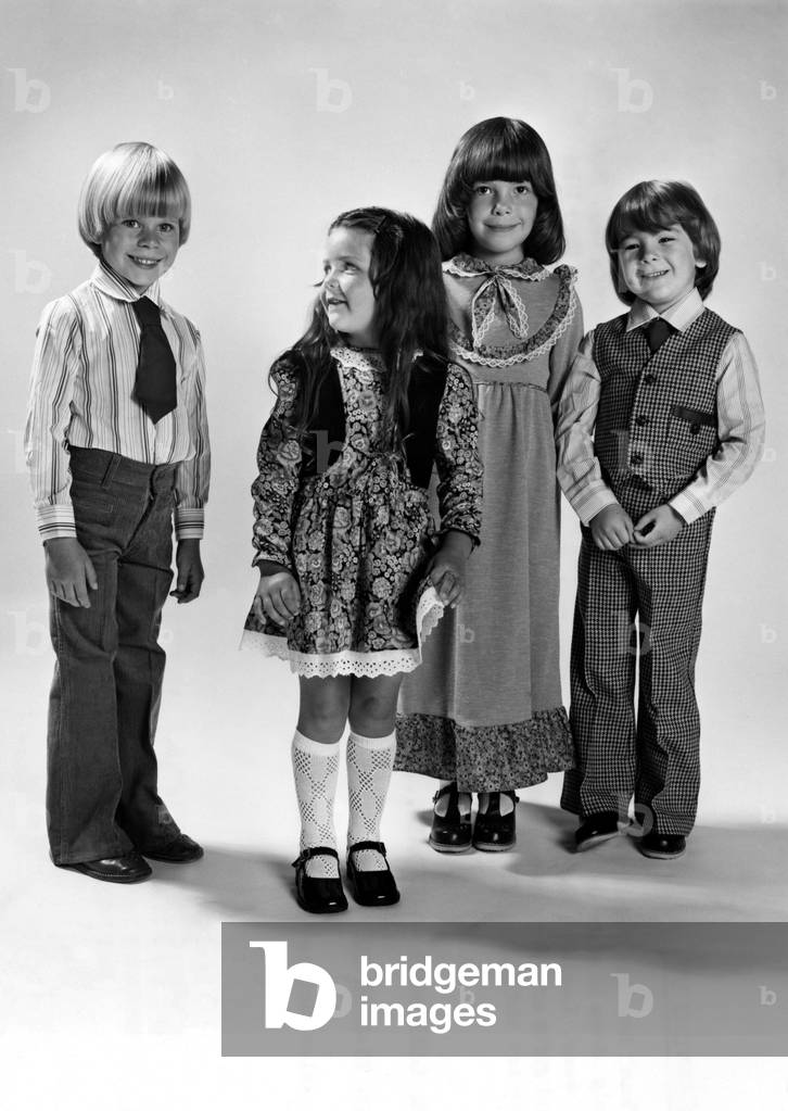 Fashion - 1970s. Growing up. Thank heavens for little children for they get more grown-up every day. Not only does it show in the things they say and do, but also in the clothes they like to wear. Luckily, the kids clothes manufacturers have realised that small boys and girls are very keen to dress like adults. After years of looking casual. Children are shrugging off their dungarees and slipping into sophisticated gear. Like Mum and Dad......the sophisticated kids of today. September 1978